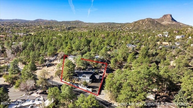 1568 W Thumb Butte Rd, Prescott, AZ 86305 - aerial view of property and surrounding area with a mountain backdrop and property parcel outlined
