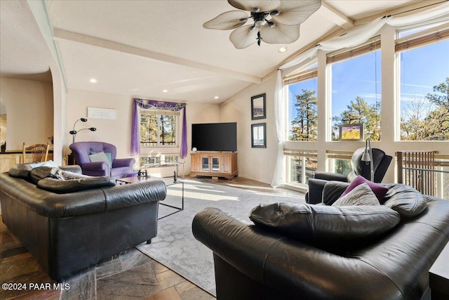 living room featuring vaulted ceiling with beams, ceiling fan, and parquet floors