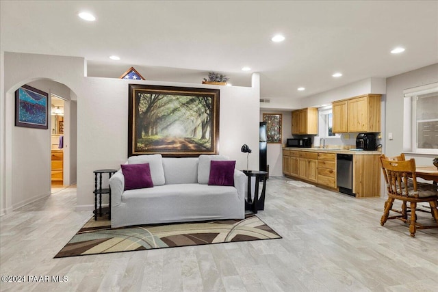 1568 W Thumb Butte Rd, Prescott, AZ 86305 - living room featuring arched walkways, recessed lighting, and light wood-style flooring