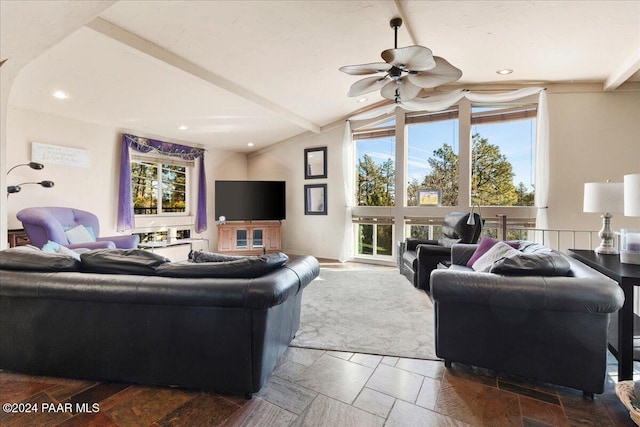 living room featuring lofted ceiling with beams and ceiling fan