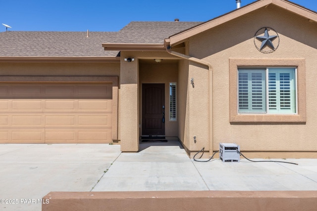 8950 N Calico Cat Trl, Prescott Valley, AZ 86315 - entrance to property with concrete driveway, stucco siding, an attached garage, and roof with shingles