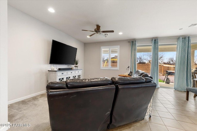 tiled living room with ceiling fan