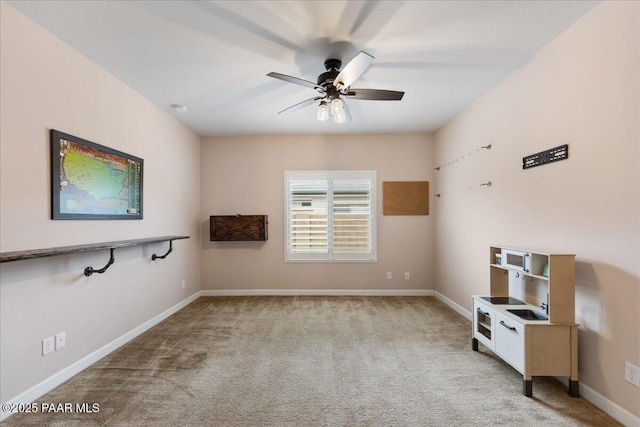 unfurnished living room featuring light colored carpet and ceiling fan