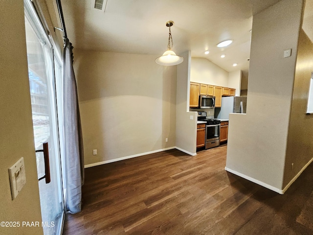 5050 N Saddleback Dr, Prescott Valley, AZ 86314 - kitchen with appliances with stainless steel finishes, dark wood-type flooring, lofted ceiling, and hanging light fixtures