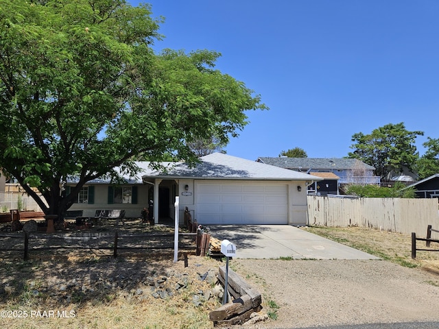 5050 N Saddleback Dr, Prescott Valley, AZ 86314 - ranch-style house featuring driveway and an attached garage