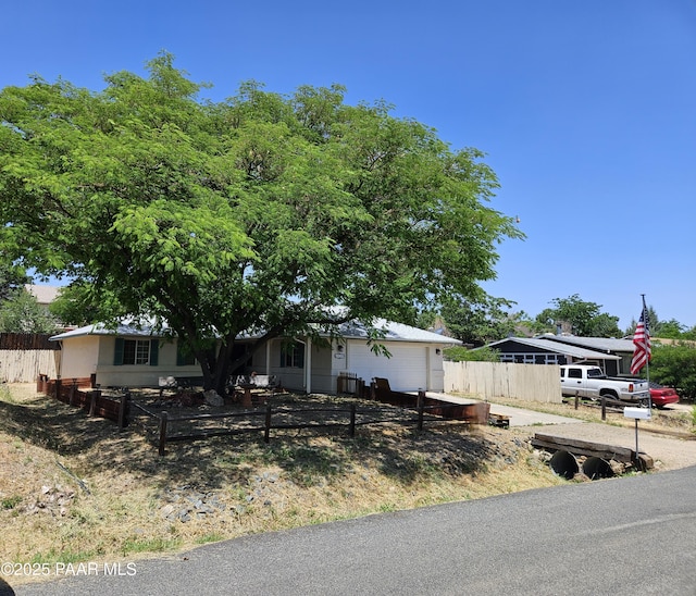 5050 N Saddleback Dr, Prescott Valley, AZ 86314 - view of front of home with a garage and driveway