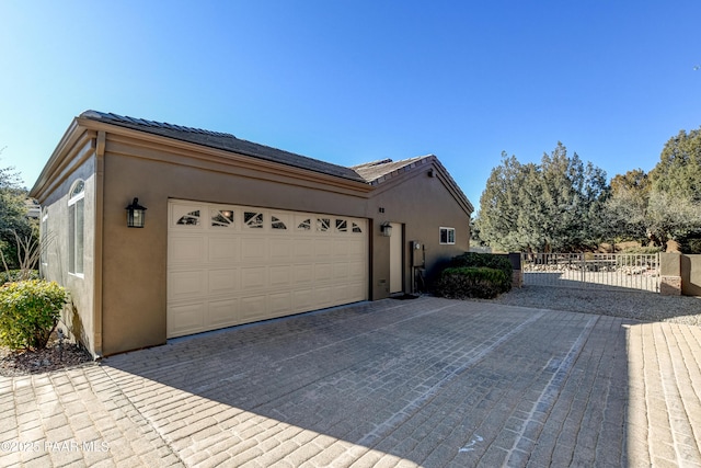 view of side of home with a garage