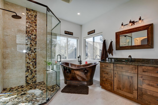 bathroom featuring vanity and plus walk in shower