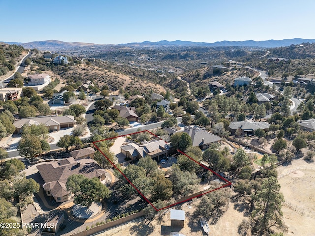 birds eye view of property featuring a mountain view