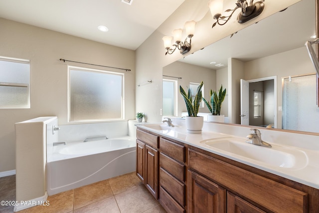 bathroom featuring tile patterned floors, a bathtub, and vanity