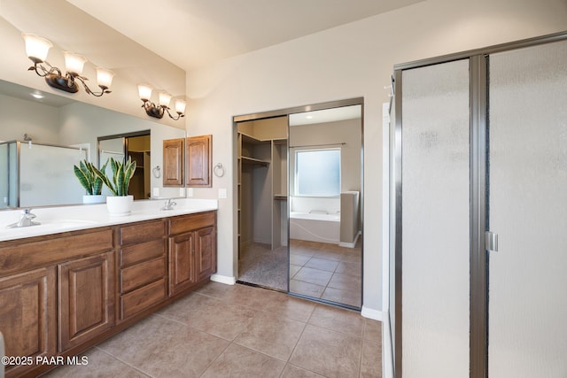 bathroom with vanity, shower with separate bathtub, and tile patterned flooring