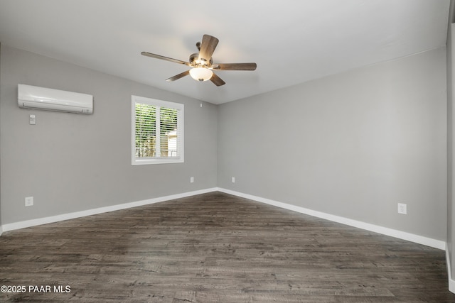 spare room featuring a wall unit AC, ceiling fan, and dark hardwood / wood-style flooring