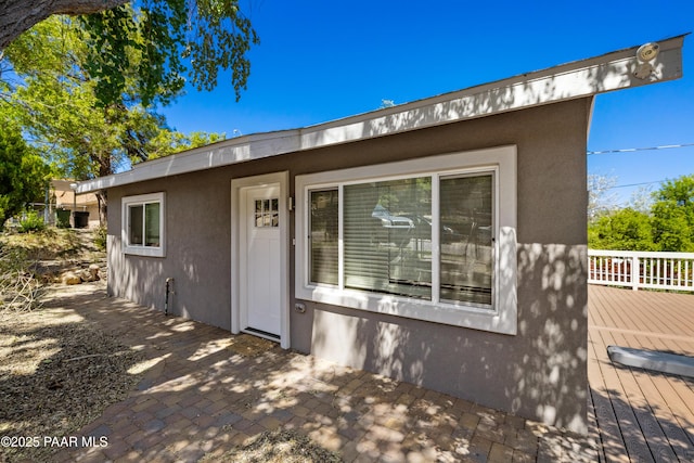 view of front of home featuring a wooden deck