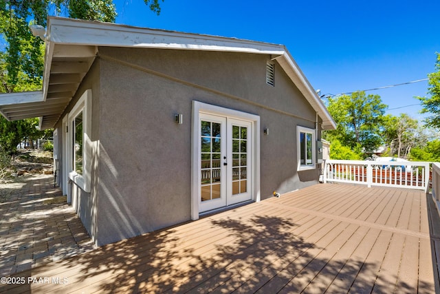 wooden terrace featuring french doors