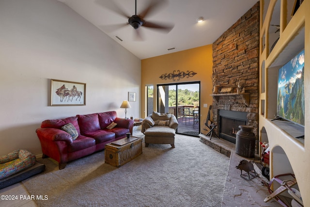 living room with ceiling fan, carpet flooring, high vaulted ceiling, and a fireplace