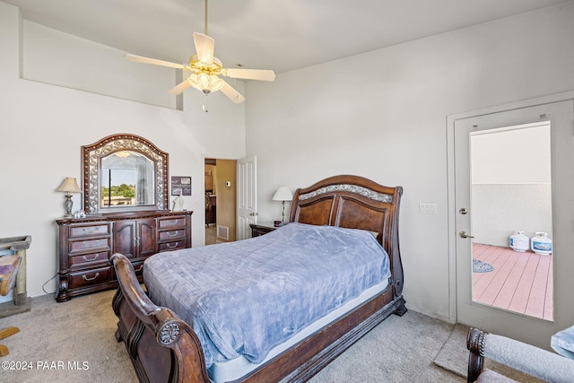 bedroom featuring light carpet and ceiling fan