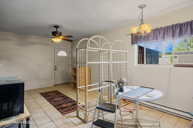 dining space featuring cooling unit, tile patterned flooring, and ceiling fan with notable chandelier