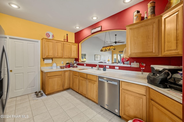 kitchen with kitchen peninsula, ceiling fan, hanging light fixtures, stainless steel dishwasher, and sink