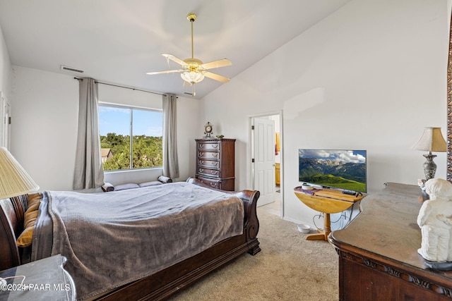 bedroom featuring ceiling fan, light carpet, and lofted ceiling