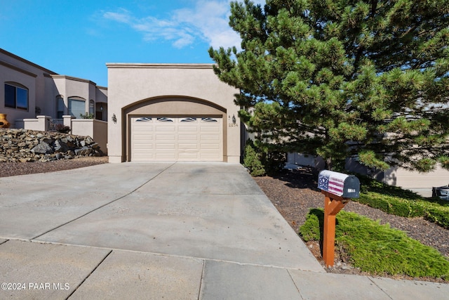 view of front of property with a garage