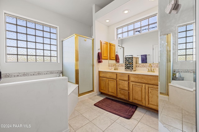 bathroom featuring vanity, tile patterned flooring, and independent shower and bath