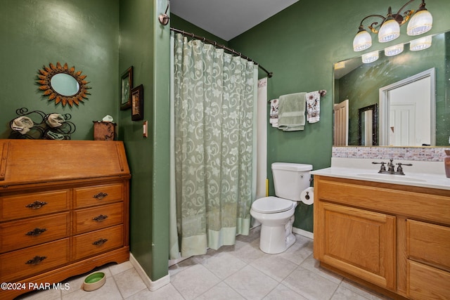 bathroom featuring toilet, vanity, tile patterned flooring, and curtained shower