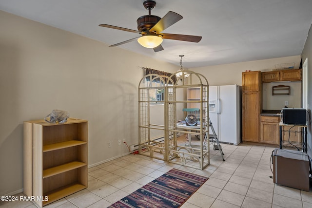 dining area with light tile patterned floors and ceiling fan with notable chandelier