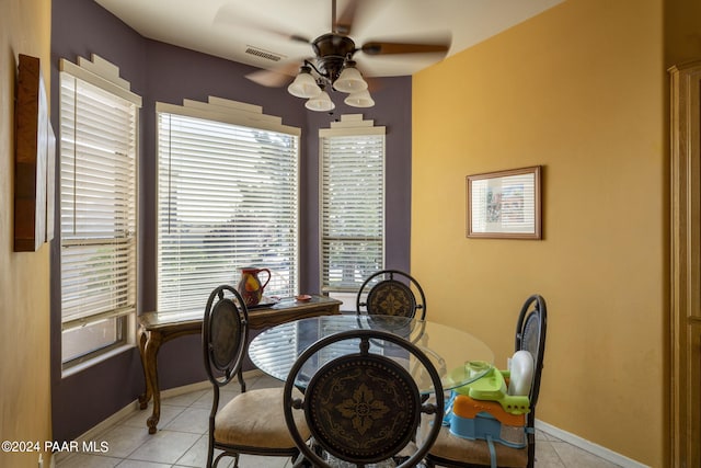 dining room featuring ceiling fan and light tile patterned floors