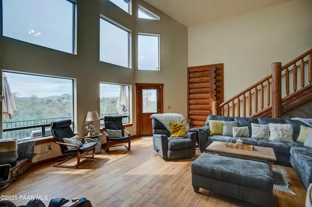 1070 Quiet Pines Ln, Prescott, AZ 86303 - living room with high vaulted ceiling, plenty of natural light, light wood finished floors, and stairway
