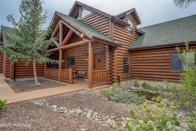 1070 Quiet Pines Ln, Prescott, AZ 86303 - view of front facade featuring roof with shingles and log siding