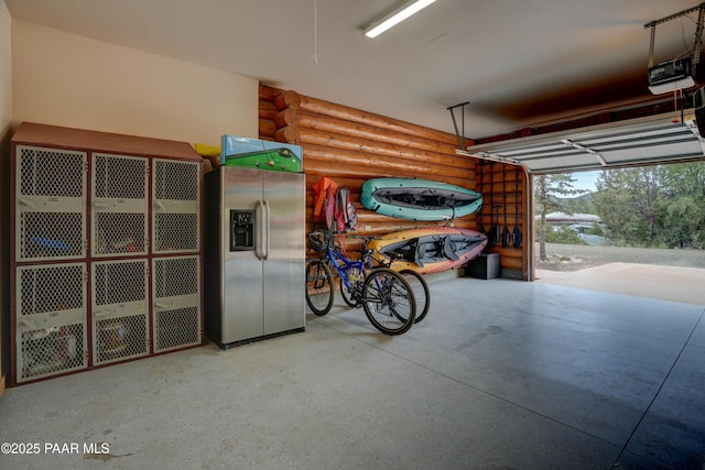1070 Quiet Pines Ln, Prescott, AZ 86303 - garage featuring stainless steel refrigerator with ice dispenser and a garage door opener