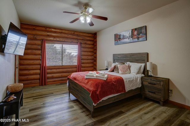 1070 Quiet Pines Ln, Prescott, AZ 86303 - bedroom with wood finished floors, multiple windows, and ceiling fan