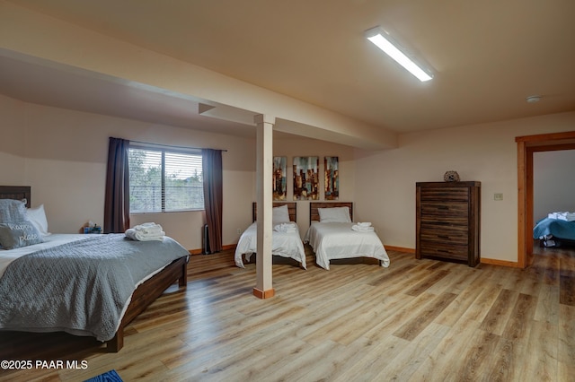 1070 Quiet Pines Ln, Prescott, AZ 86303 - bedroom with light wood-type flooring and decorative columns