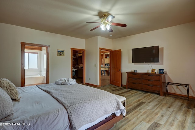 1070 Quiet Pines Ln, Prescott, AZ 86303 - bedroom with light wood finished floors, ensuite bath, a spacious closet, a ceiling fan, and a closet