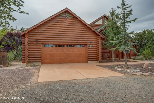 1070 Quiet Pines Ln, Prescott, AZ 86303 - log-style house with log siding, driveway, and a garage