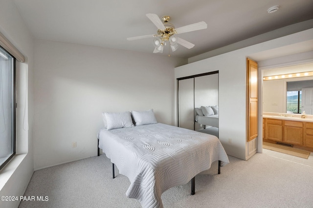 12390 E Triple T Ln, Prescott Valley, AZ 86315 - bedroom with ceiling fan, ensuite bathroom, light carpet, and a closet