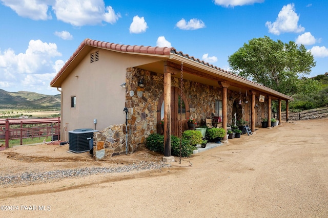12390 E Triple T Ln, Prescott Valley, AZ 86315 - view of property exterior with a mountain view and central air condition unit