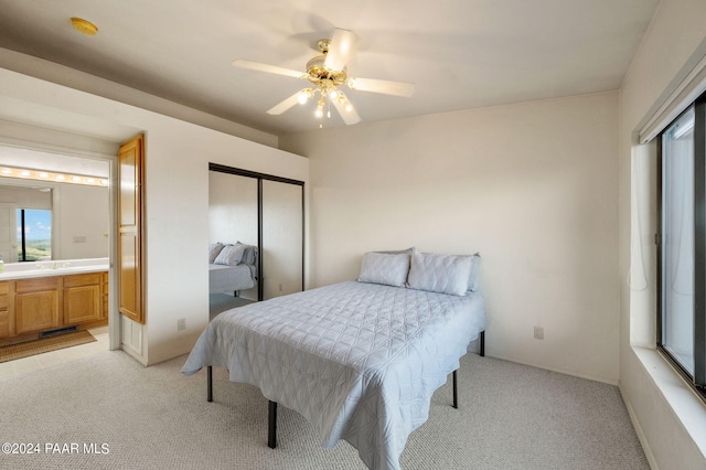 12390 E Triple T Ln, Prescott Valley, AZ 86315 - bedroom with ceiling fan, light colored carpet, connected bathroom, and a closet