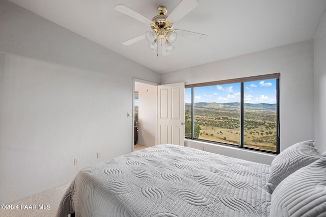 12390 E Triple T Ln, Prescott Valley, AZ 86315 - carpeted bedroom with a mountain view, ceiling fan, and lofted ceiling