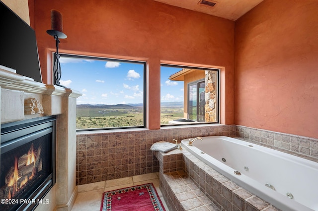 12390 E Triple T Ln, Prescott Valley, AZ 86315 - bathroom with tile patterned flooring and a relaxing tiled tub