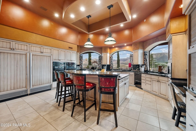 12390 E Triple T Ln, Prescott Valley, AZ 86315 - kitchen featuring a raised ceiling, a kitchen island, hanging light fixtures, and a high ceiling
