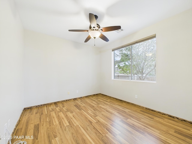 15606 E Sterling Spur Rd, Dewey-Humboldt, AZ 86327 - empty room with a ceiling fan, visible vents, and light wood-type flooring