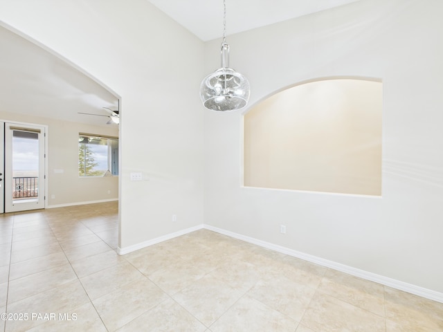 15606 E Sterling Spur Rd, Dewey-Humboldt, AZ 86327 - tiled empty room featuring baseboards, lofted ceiling, and ceiling fan with notable chandelier
