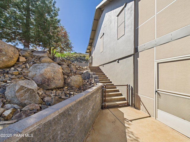 15606 E Sterling Spur Rd, Dewey-Humboldt, AZ 86327 - view of side of property with stucco siding and stairs