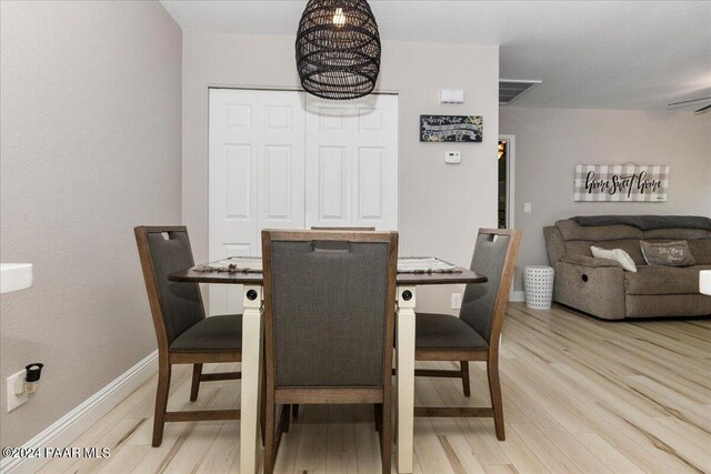 dining area with light hardwood / wood-style floors