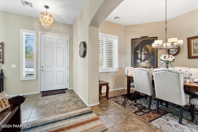 dining area with a notable chandelier