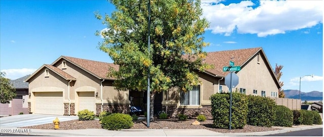 view of front of home featuring a mountain view