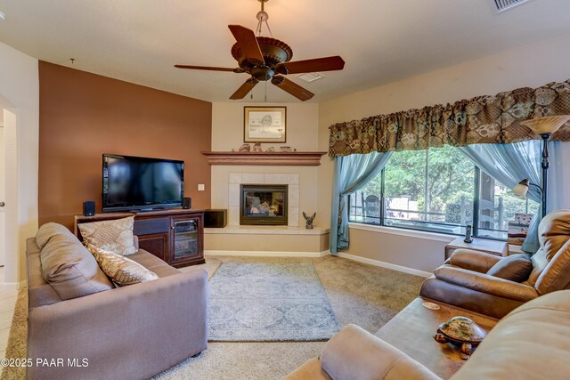 3096 Adobe Springs Dr, Prescott, AZ 86301 - carpeted living room featuring a tiled fireplace and a ceiling fan