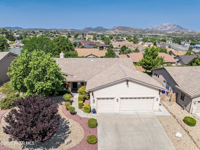 3096 Adobe Springs Dr, Prescott, AZ 86301 - single story home featuring driveway, an attached garage, a mountain view, and a residential view