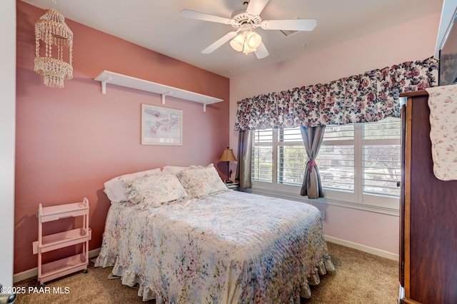 3096 Adobe Springs Dr, Prescott, AZ 86301 - carpeted bedroom featuring a ceiling fan and a chandelier